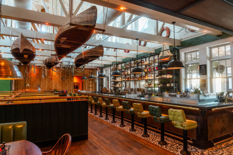 rustic bar hanging canoes sarasota interior design